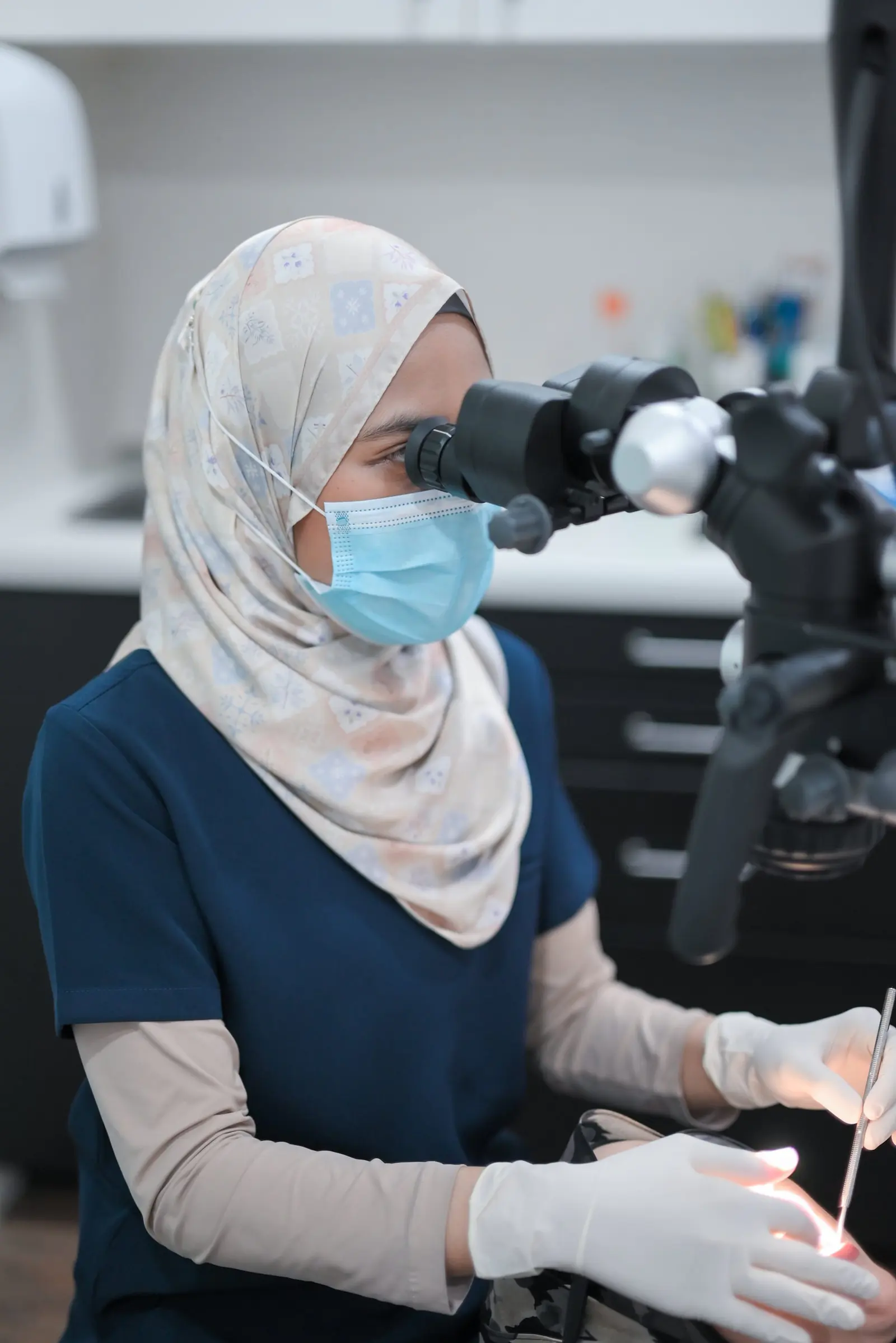 A dentist explaining treatment on screen